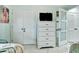 Bedroom featuring a dresser, closet doors and two beds at 1602 Stickney Point Rd # 404, Sarasota, FL 34231