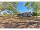 Large backyard with a charming screened porch, providing ample space for outdoor activities at 1761 Shevlin St, North Port, FL 34286