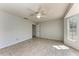 Bedroom featuring a ceiling fan, tiled floors, and lots of light at 1761 Shevlin St, North Port, FL 34286