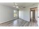 Comfortable bedroom with wood flooring, a ceiling fan, closet space, and a sunny window at 1761 Shevlin St, North Port, FL 34286