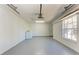 Spacious garage with laundry hookups, ample storage, and natural light from the window at 1761 Shevlin St, North Port, FL 34286