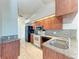 Bright kitchen showcases granite countertops, wood cabinets, and stainless steel appliances at 1761 Shevlin St, North Port, FL 34286