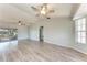 Spacious living room with high ceilings, modern flooring, and lots of natural light from sliding glass doors at 1761 Shevlin St, North Port, FL 34286