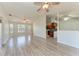 Spacious living area with modern flooring, large windows, and an open layout connecting to the kitchen at 1761 Shevlin St, North Port, FL 34286