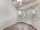Cozy room features wood floors and three sunny windows looking out onto the lawn at 1761 Shevlin St, North Port, FL 34286