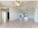 Open-concept living room featuring modern flooring, ample space, and seamless access to outdoor views at 1761 Shevlin St, North Port, FL 34286