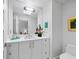 Modern bathroom with white vanity, a large mirror, and sleek fixtures, creating a clean and serene space at 1900 Harbourside Dr # 102, Longboat Key, FL 34228