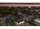 An aerial view showcasing the property's location near the water, mature trees, and neighborhood at 1932 Baywood Ter, Sarasota, FL 34231