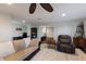 Cozy living area with a plush sofa, recliner, desk, and dark hardwood floors at 1932 Baywood Ter, Sarasota, FL 34231