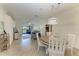 Bright and airy dining room flowing into a comfortable living room with access to outdoor screened lanai at 24068 Canterwood Way, Venice, FL 34293