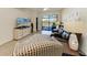 Inviting living room with a large screen TV, comfortable seating and a view of the lake at 24068 Canterwood Way, Venice, FL 34293