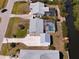 Waterfront home features screened pool, private dock and new roof in this aerial view at 2502 Larkspur Dr, Punta Gorda, FL 33950