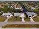Aerial view of a desirable neighborhood with canal-front properties and lush landscaping at 2502 Larkspur Dr, Punta Gorda, FL 33950