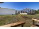 Expansive backyard featuring an enclosed pool area and storage, perfect for outdoor living at 2502 Larkspur Dr, Punta Gorda, FL 33950
