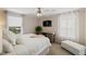 This bedroom boasts a TV, neutral decor and a view at 2502 Larkspur Dr, Punta Gorda, FL 33950