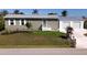 Charming home with a well-manicured lawn, a detached garage and enhanced curb appeal at 2502 Larkspur Dr, Punta Gorda, FL 33950