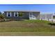 Charming home boasts a well-maintained lawn, a detached garage, and enhanced curb appeal at 2502 Larkspur Dr, Punta Gorda, FL 33950