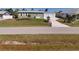 Charming single-story home with a well-maintained lawn, detached garage, and inviting curb appeal at 2502 Larkspur Dr, Punta Gorda, FL 33950
