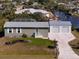 Aerial view of charming single-story home with detached two-car garage and canal access at 2502 Larkspur Dr, Punta Gorda, FL 33950