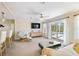 Bright living room boasts sliding glass doors offering seamless access to the pool and outdoor area at 2502 Larkspur Dr, Punta Gorda, FL 33950