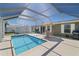 Enclosed pool area features a refreshing pool and outdoor seating, perfect for relaxing and entertaining at 2502 Larkspur Dr, Punta Gorda, FL 33950