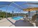 Inviting caged pool area with ample seating and views at 2502 Larkspur Dr, Punta Gorda, FL 33950