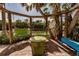 Fun garden bar with colorful painted swing and chairs, perfect for relaxing and entertaining guests at 288 Island Cir, Sarasota, FL 34242