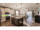 Modern kitchen with stainless steel appliances, an island with seating, and an open layout at 2962 Trustee Ave, Sarasota, FL 34243