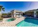 Community pool and hot tub area featuring a sun lounger sitting area and bathrooms at 2962 Trustee Ave, Sarasota, FL 34243