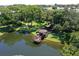 Scenic aerial shot showcasing the community's picturesque pond with a charming gazebo at 315 30Th W Ave # B214, Bradenton, FL 34205