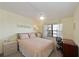 Cozy bedroom with a bed, office space, and lots of light at 315 30Th W Ave # B214, Bradenton, FL 34205