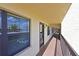 Exterior hallway of building features railing and view to outside at 315 30Th W Ave # B214, Bradenton, FL 34205