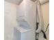 Efficient stacked washer and dryer in a dedicated laundry area at 315 30Th W Ave # B214, Bradenton, FL 34205