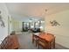 Open living room with a comfortable sofa, ceiling fan, and dining set at 315 30Th W Ave # B214, Bradenton, FL 34205