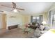 Spacious living room with comfortable seating, a large window, and a view of the community at 315 30Th W Ave # B214, Bradenton, FL 34205