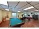 Recreation room with pool table and workout equipment, offering plenty of options for fitness and leisure activities at 315 30Th W Ave # B214, Bradenton, FL 34205