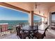 Balcony with chairs, table, and spectacular ocean views at 35 Watergate Dr # 1103, Sarasota, FL 34236