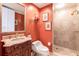 Bathroom featuring a single sink vanity, toilet, and glass-enclosed shower at 35 Watergate Dr # 1103, Sarasota, FL 34236