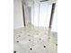 An empty bedroom with large closets and adjoining bath at 35 Watergate Dr # 1103, Sarasota, FL 34236