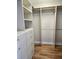 Well-organized walk-in closet featuring custom shelving, drawers, and ample storage space at 35 Watergate Dr # 1103, Sarasota, FL 34236