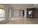 Bright living room with glossy floors, architectural columns, and a view of the balcony at 35 Watergate Dr # 1103, Sarasota, FL 34236