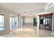 Open living space with marble floors, natural light, and views, plus a custom built-in cabinet at 35 Watergate Dr # 1103, Sarasota, FL 34236
