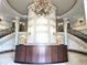Elegant lobby featuring marble floors, grand staircase and a stunning chandelier at 35 Watergate Dr # 1103, Sarasota, FL 34236