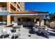 Stylish outdoor kitchen with bar seating and grill area for the perfect outdoor entertainment space at 35 Watergate Dr # 1103, Sarasota, FL 34236