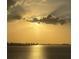 Golden hour view overlooking the city skyline, with sunlight streaming through the clouds over the water at 35 Watergate Dr # 1103, Sarasota, FL 34236