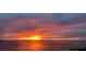 Beautiful sunset view over the water, painting the sky with vibrant shades of orange, pink and purple hues at 35 Watergate Dr # 1103, Sarasota, FL 34236