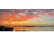 Beautiful orange sunset over the water, creating a serene waterfront view at 35 Watergate Dr # 1103, Sarasota, FL 34236