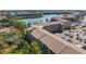 Aerial view of lakeside condos with convenient parking and beautiful surrounding landscape at 3664 Lake Bayshore Dr # K323, Bradenton, FL 34205