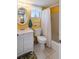 Bathroom with a modern vanity, toilet, shower/tub combo, and simple decor at 3664 Lake Bayshore Dr # K323, Bradenton, FL 34205