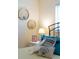 Close up of decorated bedside table with stylish lamp, decorative artwork, and pillows at 3664 Lake Bayshore Dr # K323, Bradenton, FL 34205